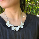 A Roost of Butterflies Necklace in Silver