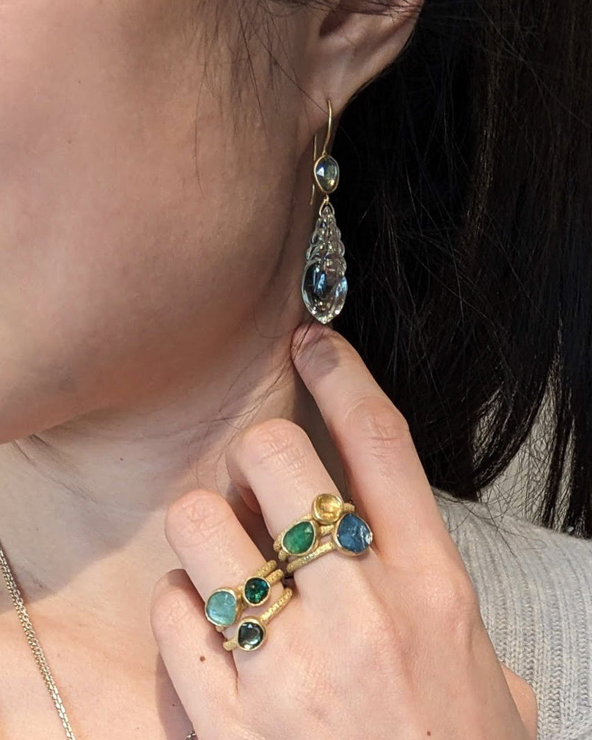 Carved Fluorite Shell Earrings with Green Sapphires in 18k Yellow Gold